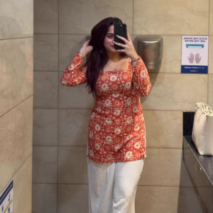 Women's Rust Orange Floral Kurti with White Pants Office Wear Outfit